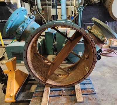 Corroded internal diffuser of chiller with heavy rust and metal loss before repair.