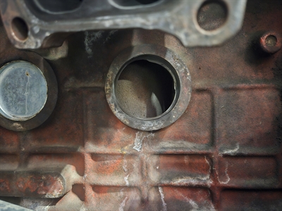 Freeze plug removed from the engine block.