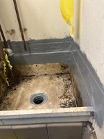 Waterproofed mop sink using Belzona MR7 system.