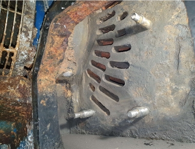 The corroded surface has been ground back to the metal