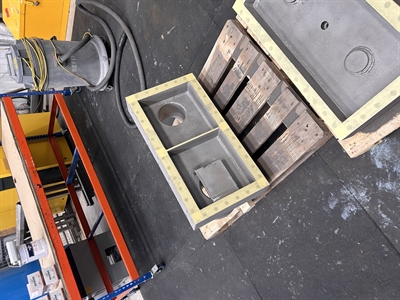 The two sections of the steel header box arrive on a pallet