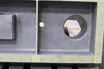 The steel boxes have edges masked in with sellotape and the surface has been grit blasted