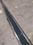 The joint in the concrete floor is sealed with the Belzona solution