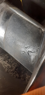 The prepared area of the screw conveyor shows defects to be rebuilt
